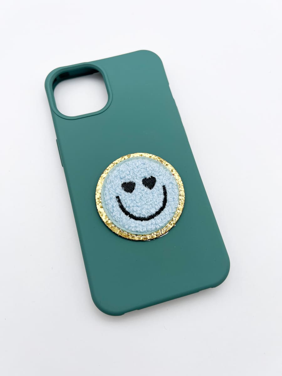 Hülle petrol mit Smileysticker hellblau