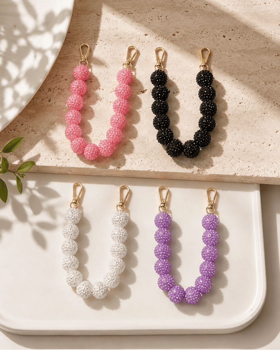 Kurze Handykette Sparkling Bubbles auf Unterlage