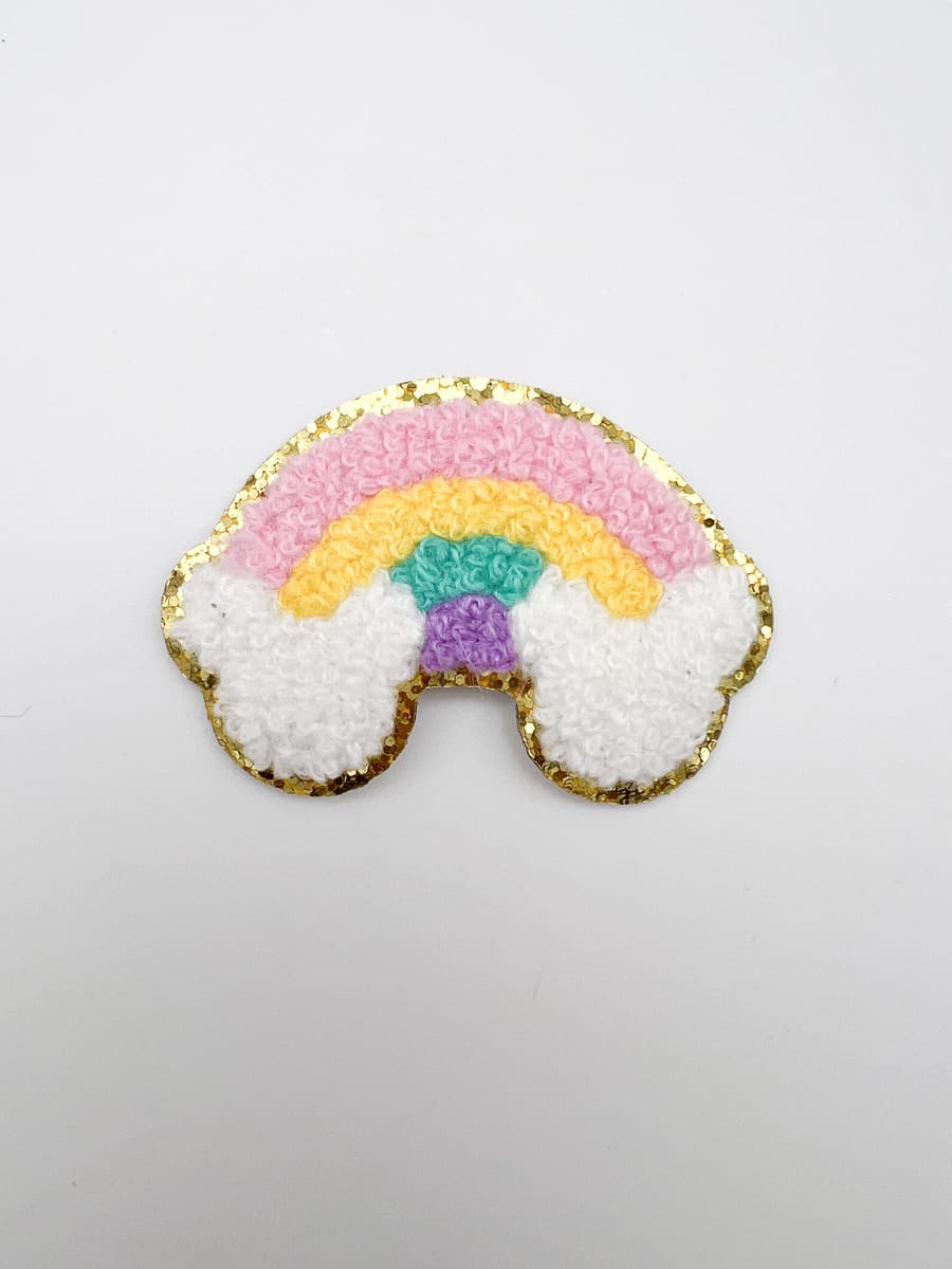 Sticker mit Regenbogen und Glitzer